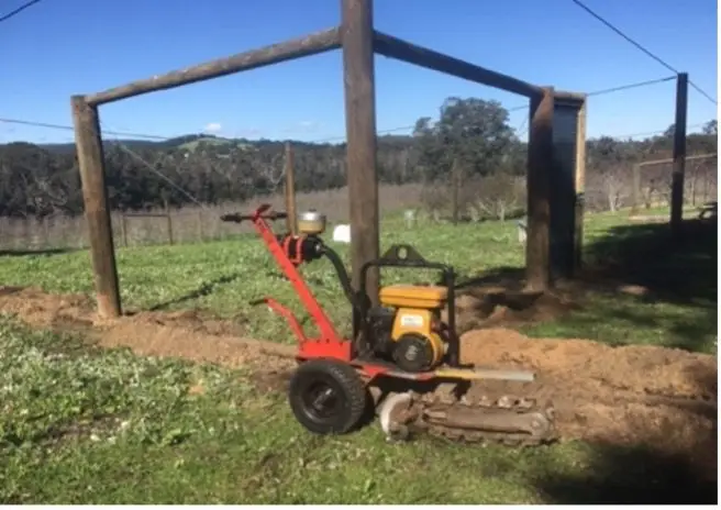 Trencher for digging external perimeter of orchard structure