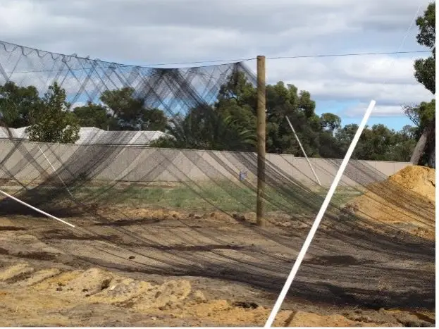 Spreading bird netting over wires before tensioning